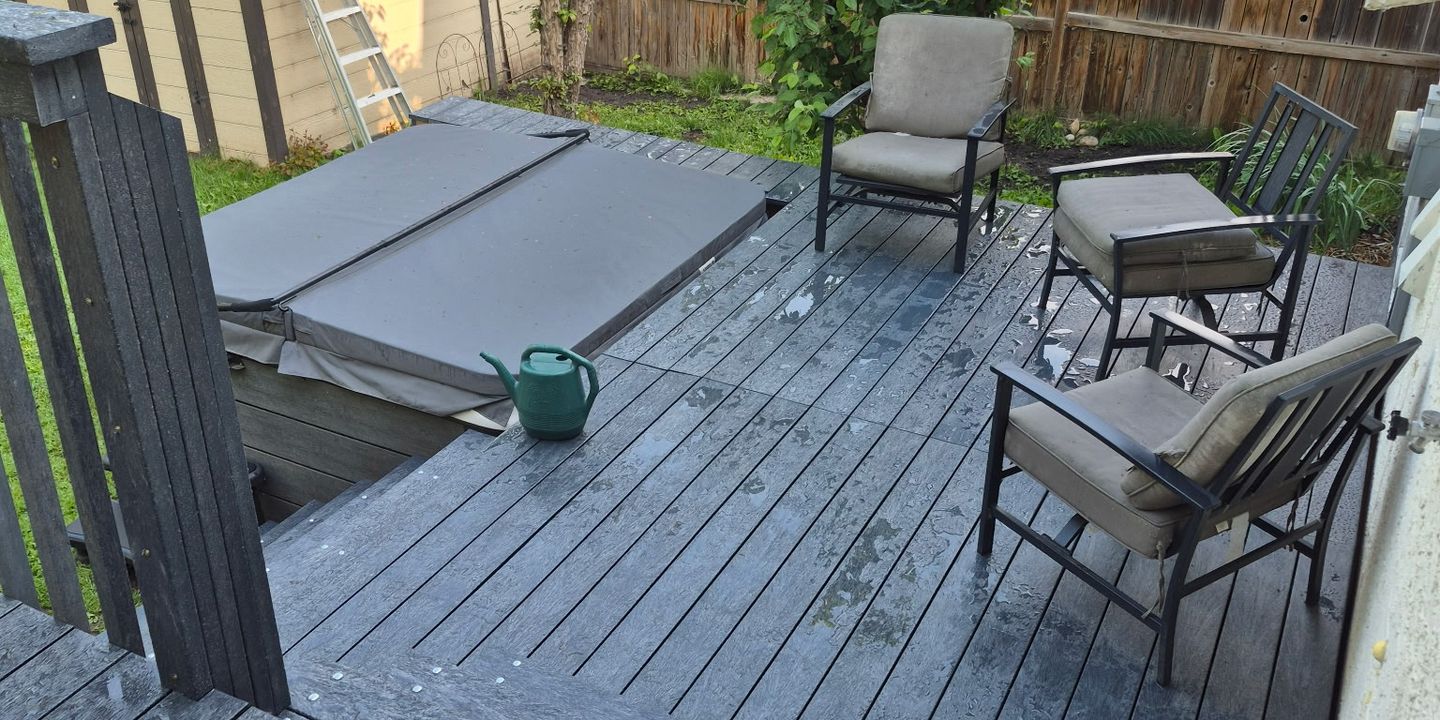 A backyard deck in recycled plastic lumber with loungers