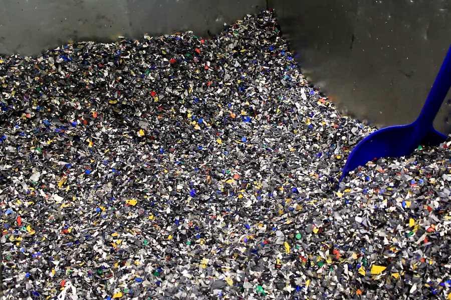 Recycled HDPE pails ground down into flake, the feedstock for plastic lumber